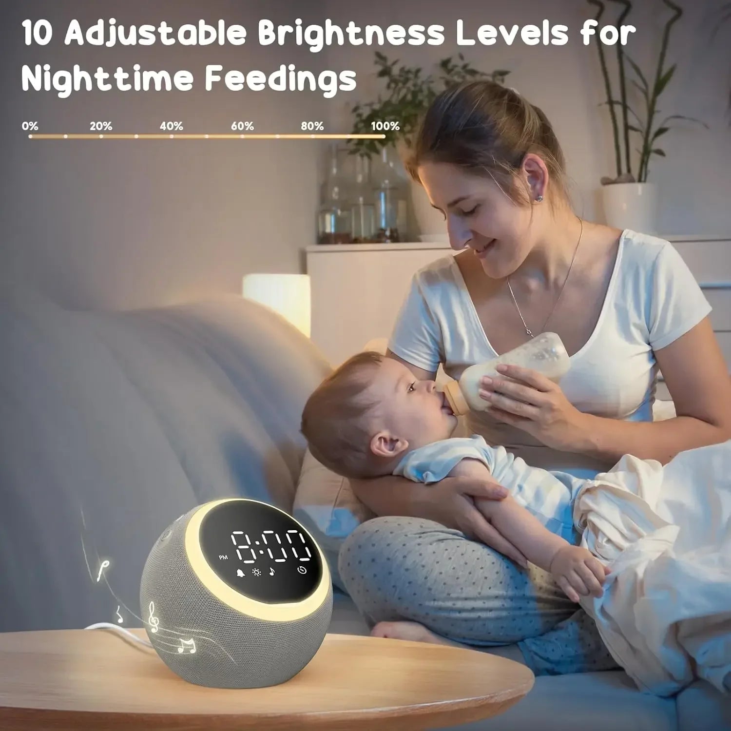 Mother feeding baby with bottle on couch next to a digital white noise machine with adjustable brightness